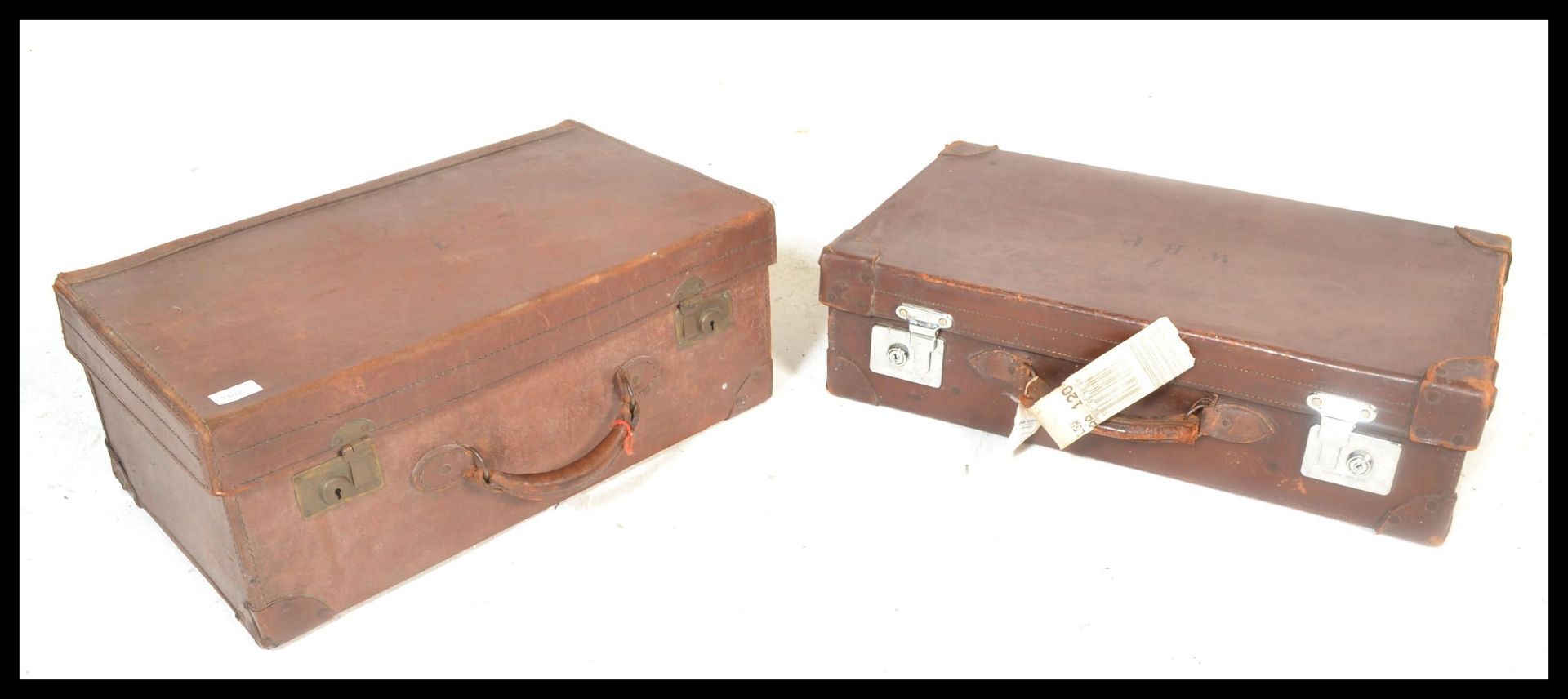 Two early 20th Century good quality pig skin / leather travel suitcases, both with clasps and