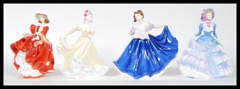 A selection of four Royal Doulton ' Pretty Ladies ' figurines to include ' Elaine ' HN 4718, '