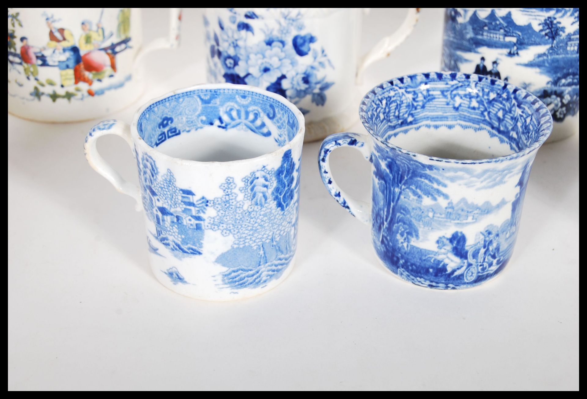 A collection of 19th Century Victorian Staffordshire mugs and cups, most having blue and white - Bild 5 aus 13