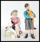 Two Royal Doulton limited edition collectable ceramic figurines to include Welcome Home (415) HN