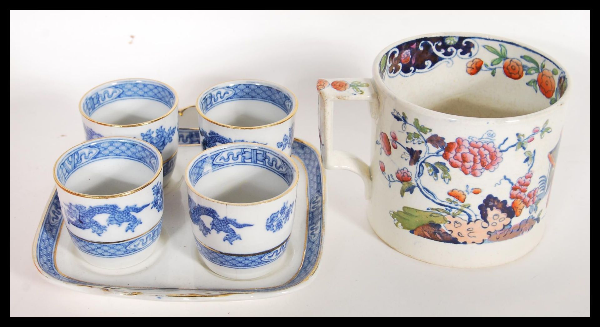 A collection of 19th Century Victorian Staffordshire mugs and cups, most having blue and white - Bild 12 aus 13