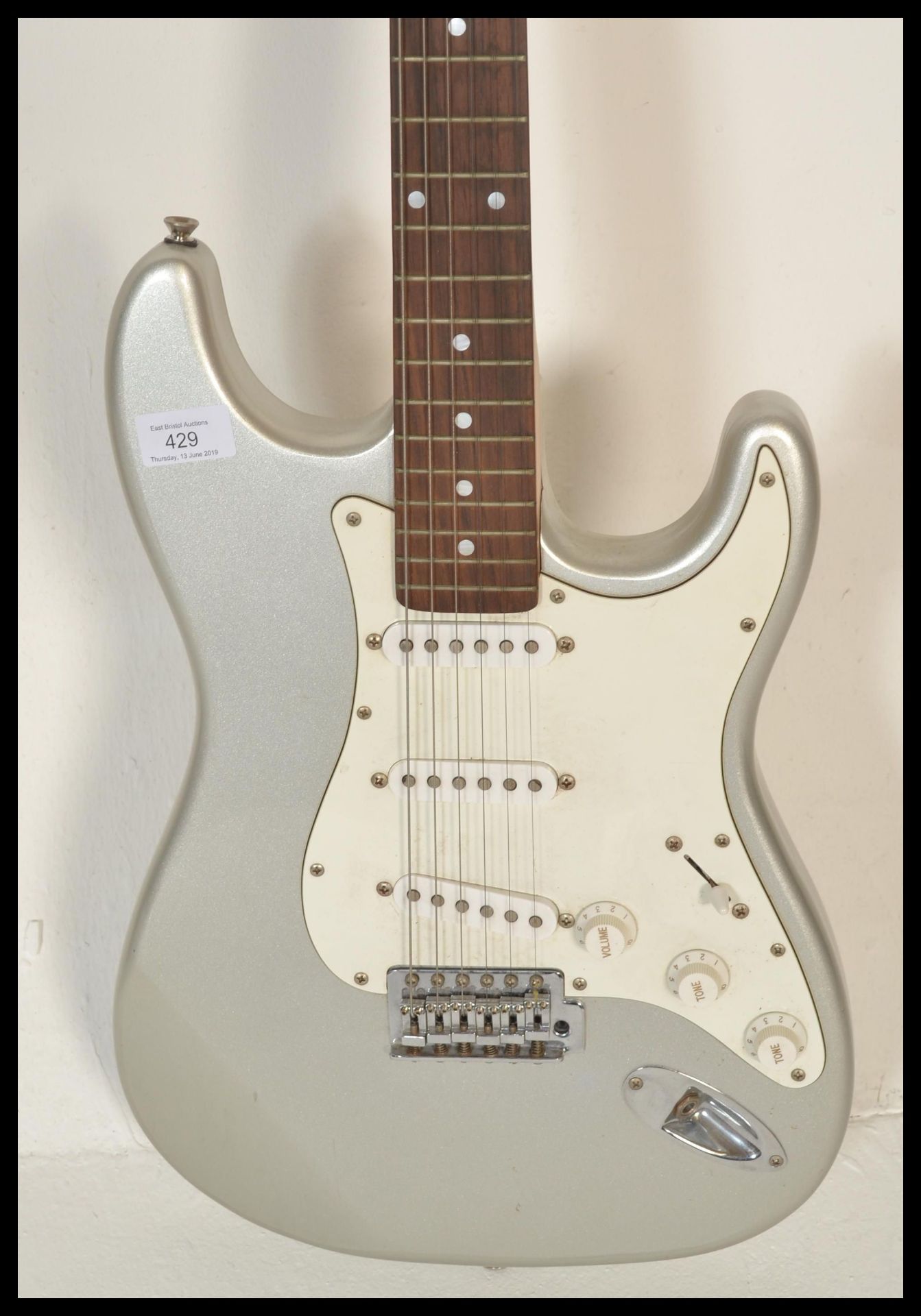 An Aria six-string STG Series electric guitar, silver body with white scratch guard and pick up. - Bild 4 aus 5