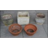 A selection of garden pot planters to include a pair of reconstituted stone pots with chamfered