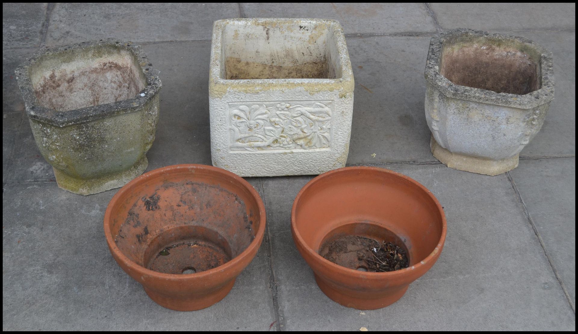 A selection of garden pot planters to include a pair of reconstituted stone pots with chamfered