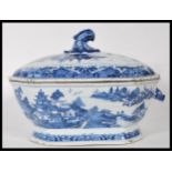 An early 18th century Chinese blue and white large tureen and lid having chinoiserie decoration with