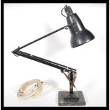 A 20tyh Century 1940's Industrial pre-war Herbert Terry anglepoise lamp, raised on a cast metal