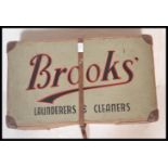 A vintage early 20th Century Industrial Brooks Laundry advertising cardboard box having red