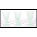 A set of six 20th Century green jadeite goblets of small proportions having bell shaped bowls raised