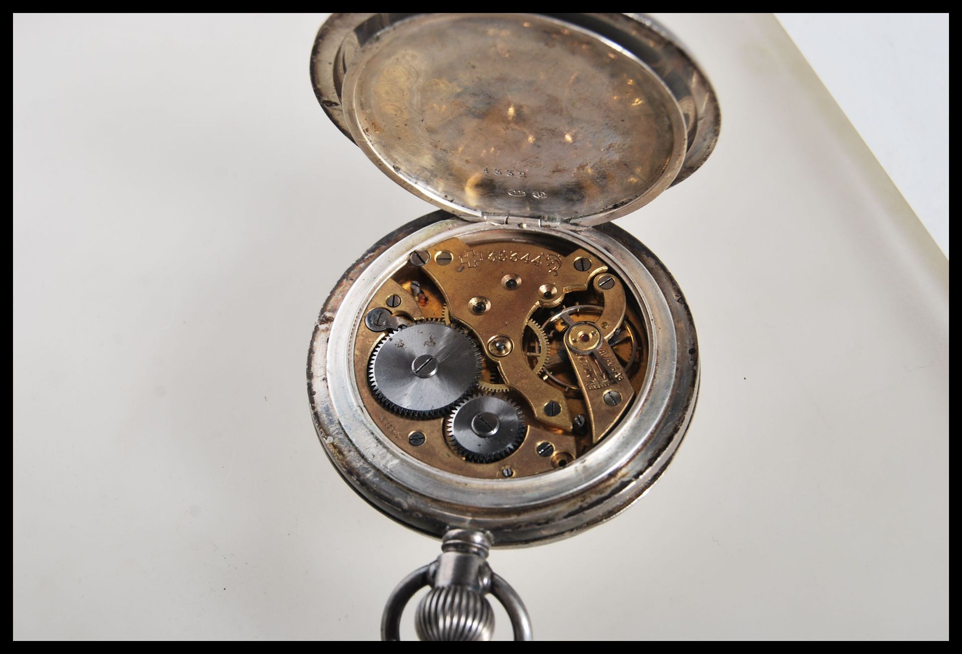 An early 20th Century silver pocket watch having a white enamelled face with roman numerals to the - Image 8 of 9