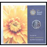 The Royal Mint uncirculated 2009 Kew Gardens 50p coin, mounted to its original presentation card.