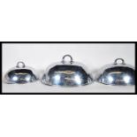 A set of three graduating late 19th Century / early 20th Century silver plated meat cloches / covers