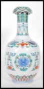 A 20th Century Chinese vase having wasted neck falling into a bulbous body, being Wucai having