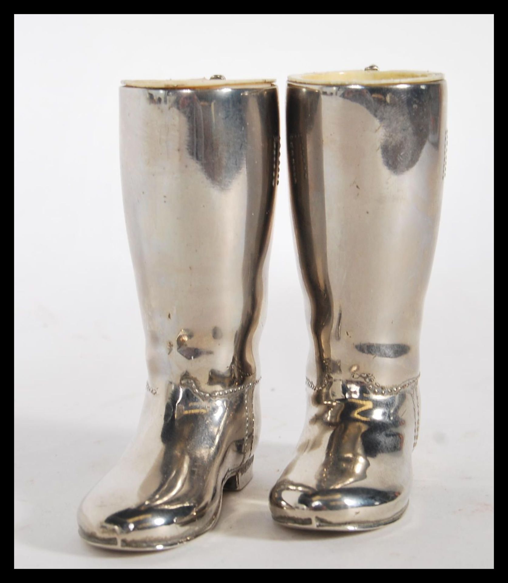 A pair of 20th century silver plated drinks measures for spirits in the form of horde riding - Image 2 of 4
