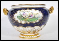 A late 19th Century Royal Worcester soup tureen of large form, having twin carrying handles finished