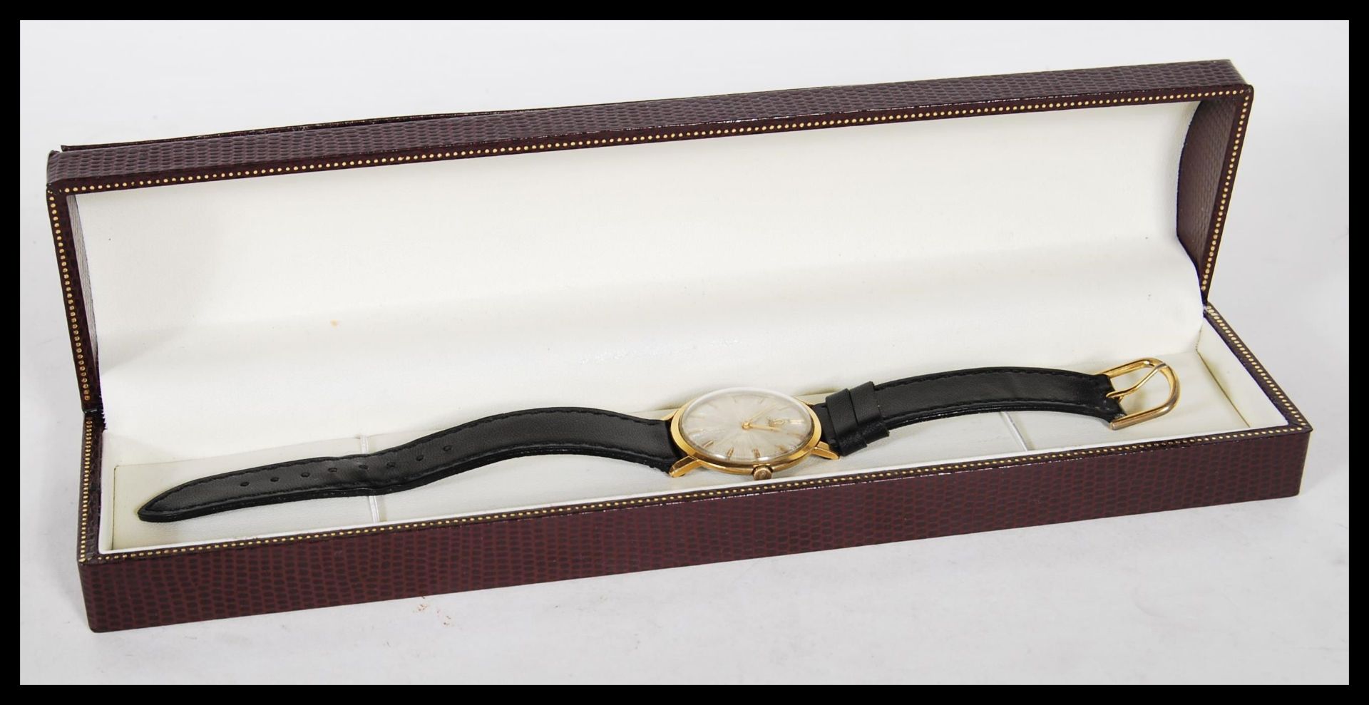 A vintage 20th Century gilt cased Omega mechanical wrist watch, gilt baton markers with a mother