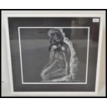 A 20th Century chalk pastel drawing depicting a reclined female nude depicted in white on black