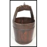 A 19th Century Chinese coopered wooden elem water pail/ bucket, being wrought iron banded.