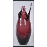 A 20th Century purple amethyst studio glass vase of tapering cylindrical form having four shaped