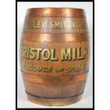 An early 20th Century coppered oak brass bound counter top point of sale sherry barrel advertising