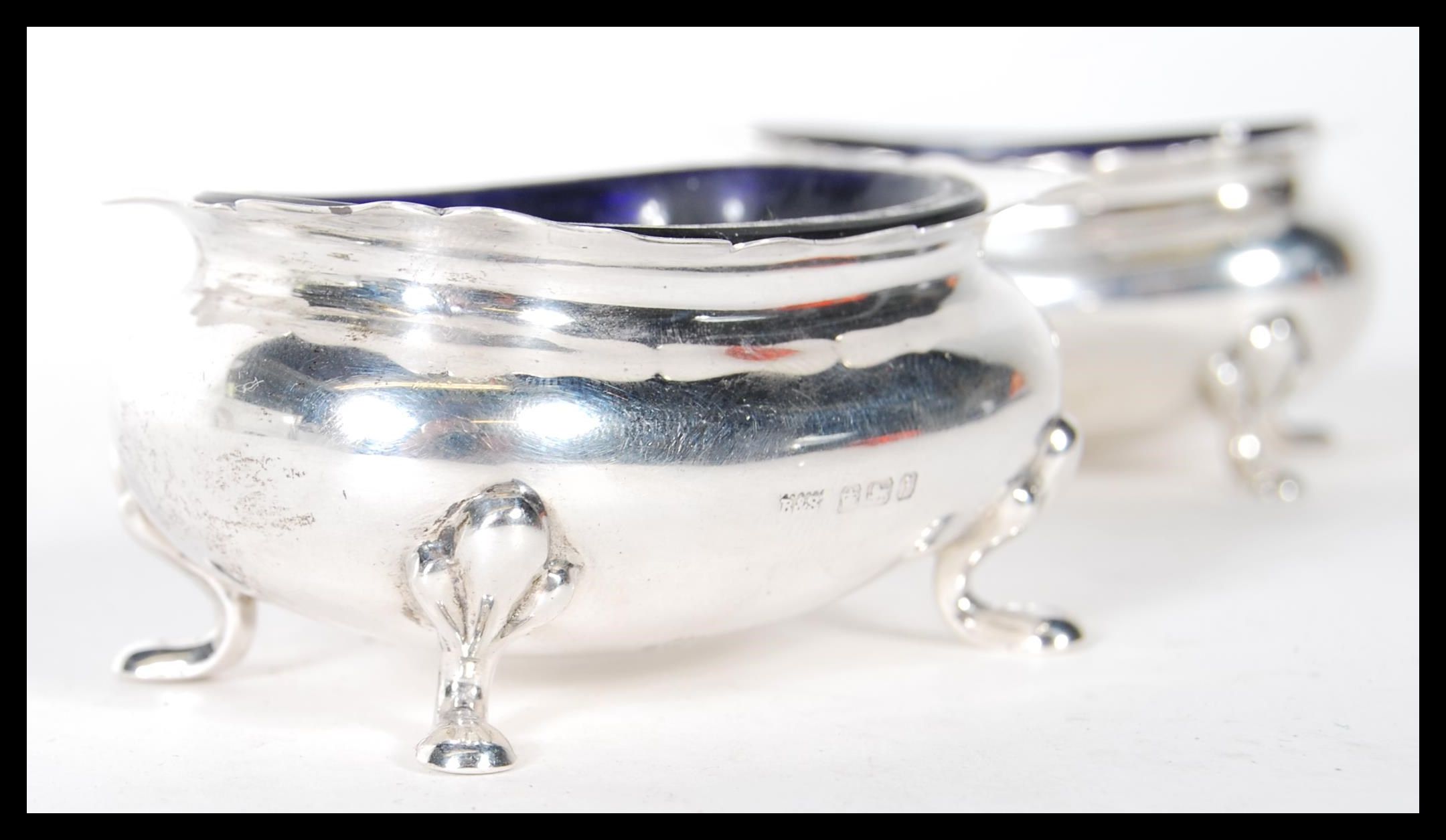 A pair of silver hallmarked Brook & Sons of Edinburgh blue glass lined table salts, all raised on - Image 5 of 5
