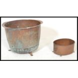 An early 19th century Victorian large copper pot, having rivets base detailing together with a