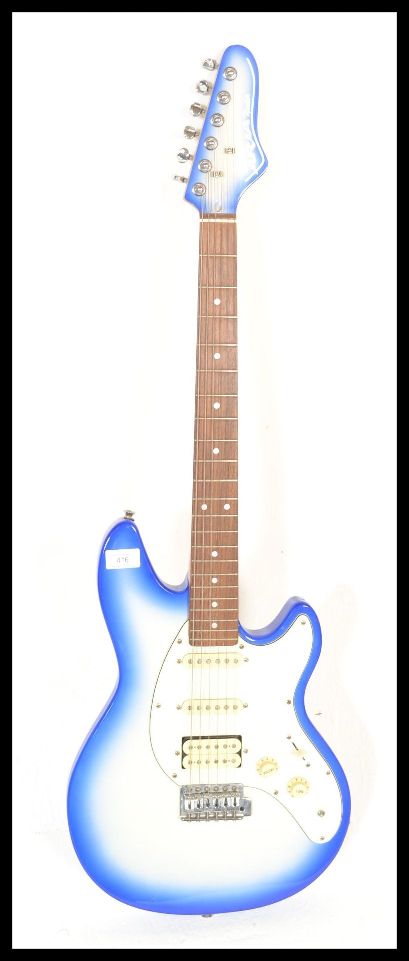 An Aria Nextar six-string STG Series electric guitar, sky blue sunburst body with white scratch