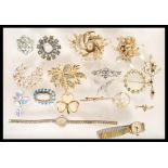 A collection of vintage costume jewellery to include a selection of 60's gold tone brooches,