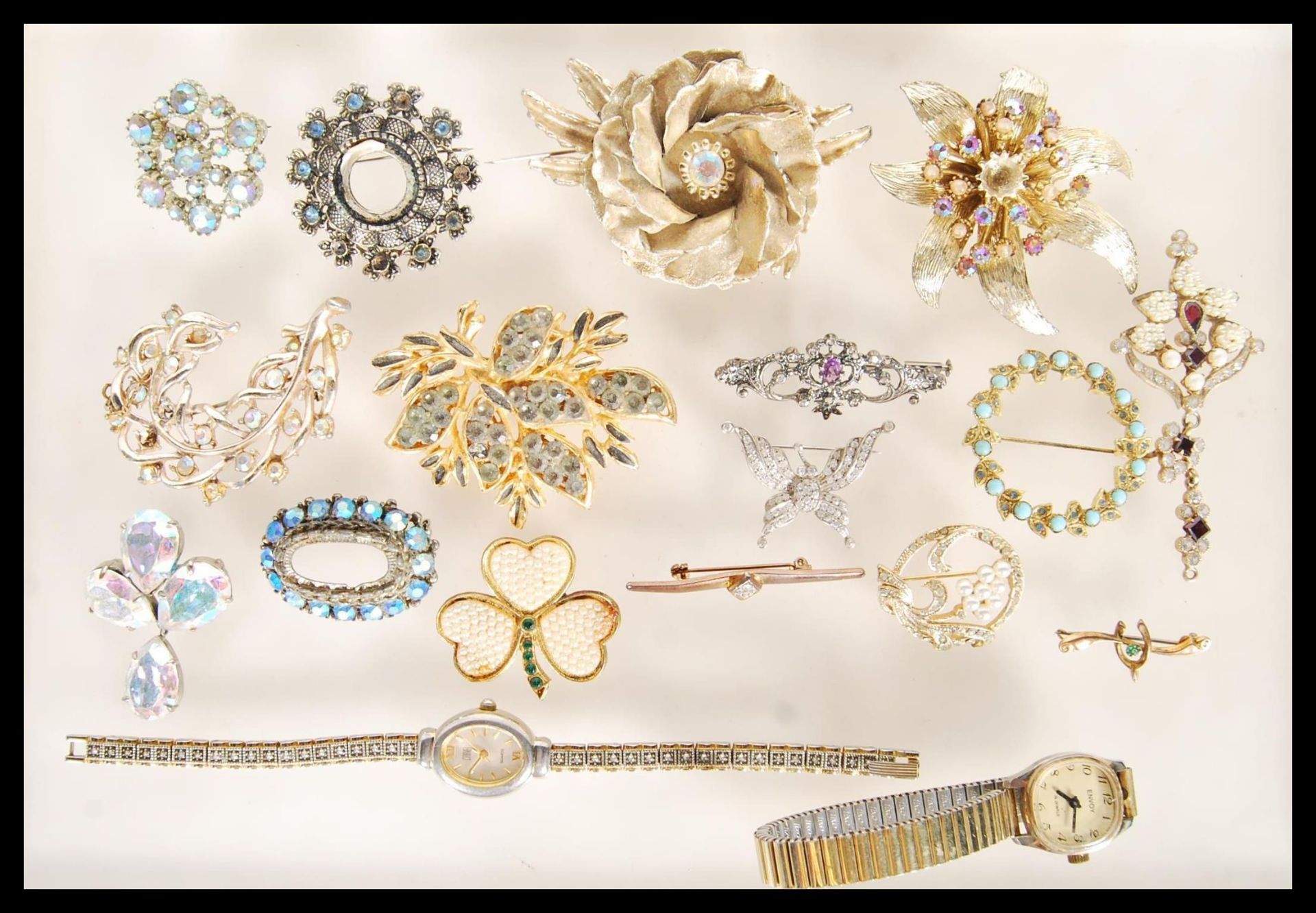 A collection of vintage costume jewellery to include a selection of 60's gold tone brooches,