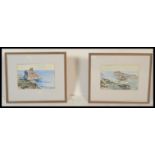 A pair of 20th century watercolour paintings of coastal rocky scenes being signed to the corner