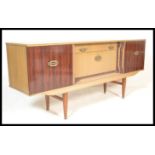 A vintage retro 20th Century two tone melamine sideboard / credenza, central bank of drawers flanked