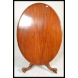 A 19th century High Victorian walnut tilt top breakfast loo table - dining table. Raised on shaped