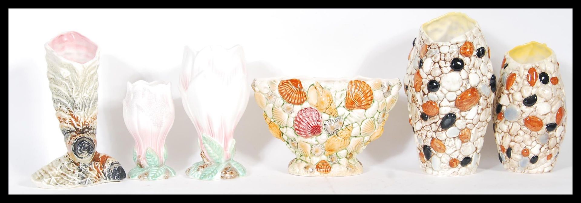 A group of six 20th Century Sylvac vases to include two Magnolia vases in pink and white, with