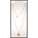 A group of three 20th Century 9ct gold necklaces to include a figaro chain with a spring ring