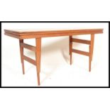 A stunning mid 20th Century teak wood Danish adjustable metamorphic dining / coffee table,