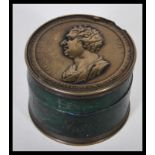 Politics - a 19th Century circular ebony and medallic snuff box, commemorating the life of Charles