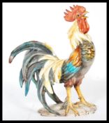 A 20th Century Italian Majolica ceramic cockerel rooster in a standing and crowing position, being