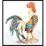 A 20th Century Italian Majolica ceramic cockerel rooster in a standing and crowing position, being