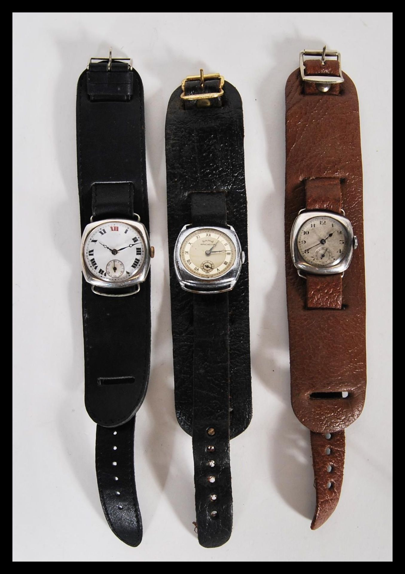 A selection of vintage 1920's watches to include a continental silver watch having a white enamelled