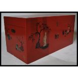 A large decorative 20th century Red lacquer Chinese chest / trunk. The red painted body with