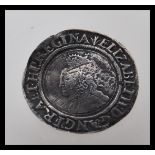 A hammered 16th Century Elizabethan coin , believed to be a silver sixpence, dated 1562 having a