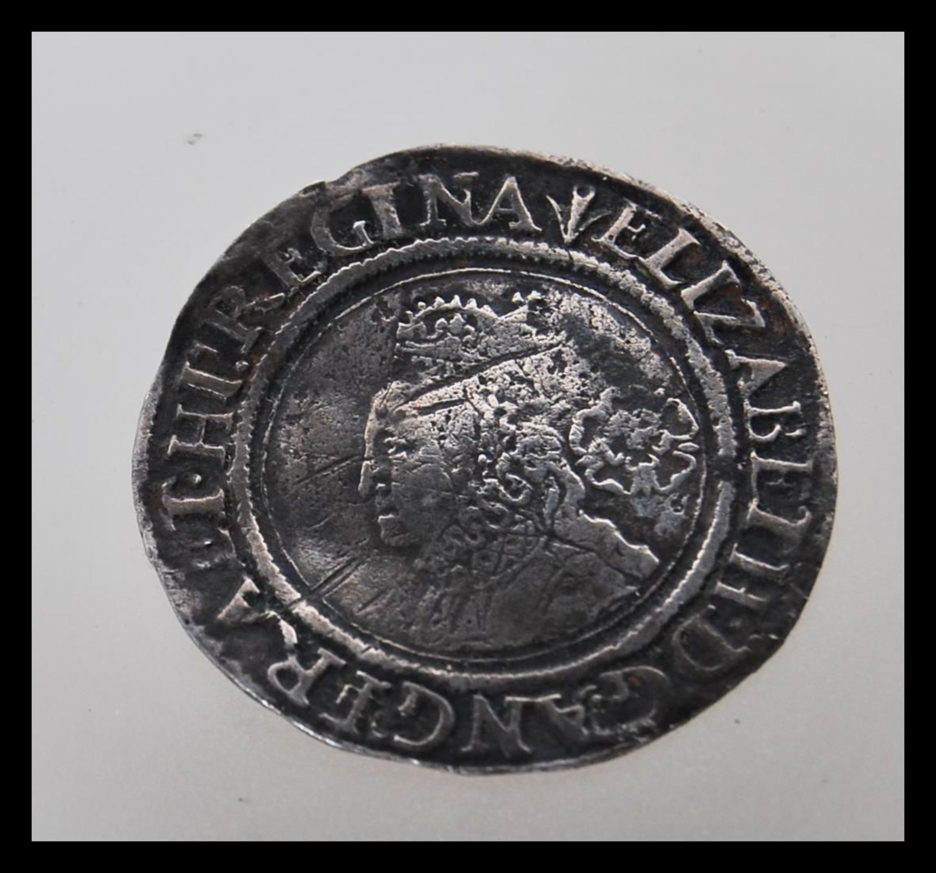 A hammered 16th Century Elizabethan coin , believed to be a silver sixpence, dated 1562 having a