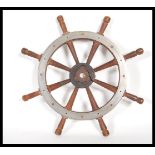 A vintage early 20th century teak wood & steel rim eight spoke ship's wheel.Measures 37cm wide.