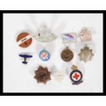 A collection of vintage 20th Century badges to include, an enamel National League of Airmen,