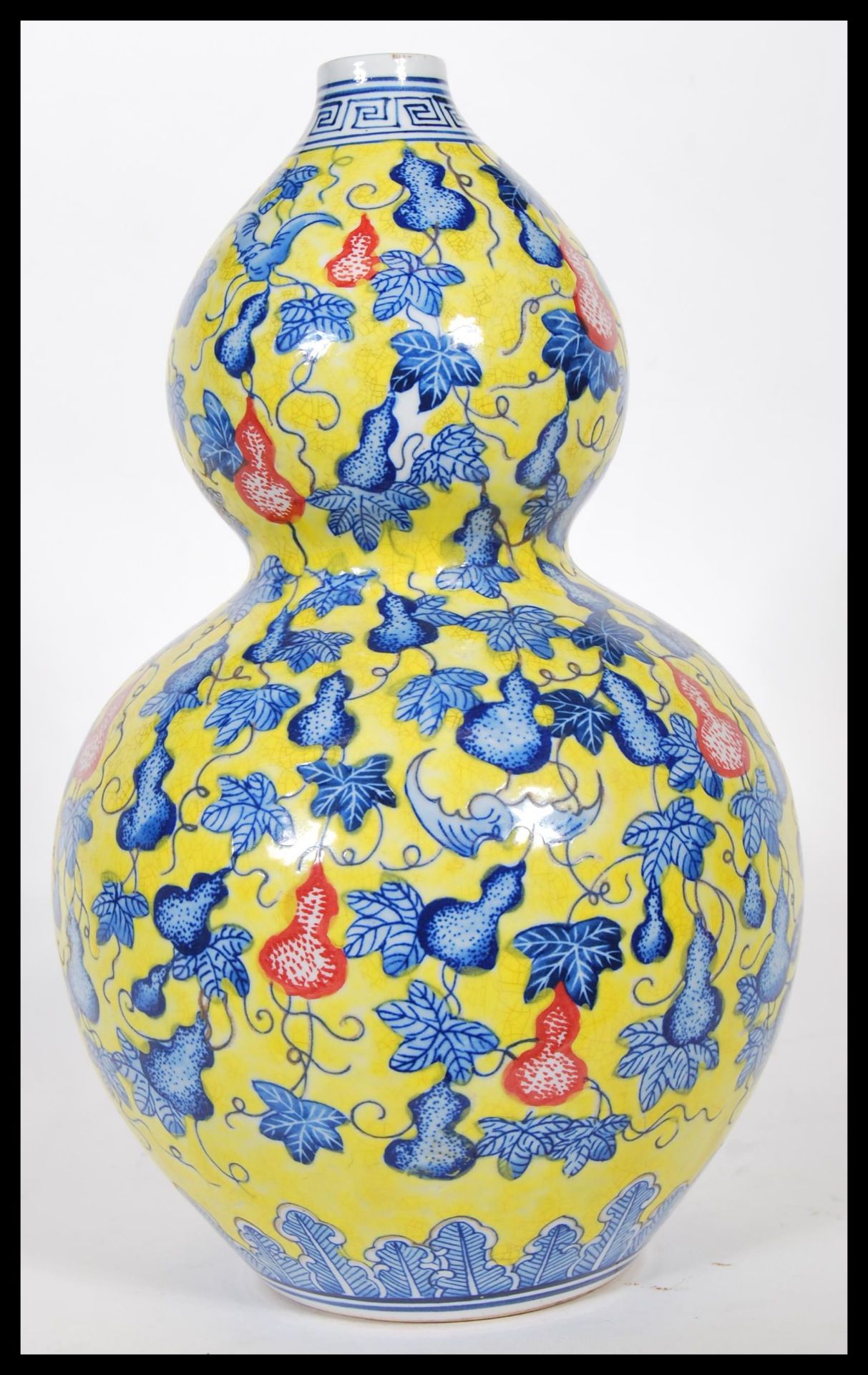 A 20th Century Chinese Juane ground double gourd vase, with blue decoration depicting bats around