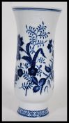 A 20th Century Meissen onion spill vase having a white ground with blue floral sprays. Crossed sword