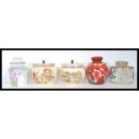 A collection of 20th Century tobacco jars and lids to include a luster floral design marks M Z