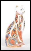 A Royal Crown Derby Imari paperweight in the form of a Siamese cat, dated MMI for 2001, gold stopper
