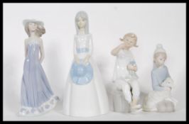 A collection of three 20th Century Spanish Lladro ceramic figurines modelled as young girls together