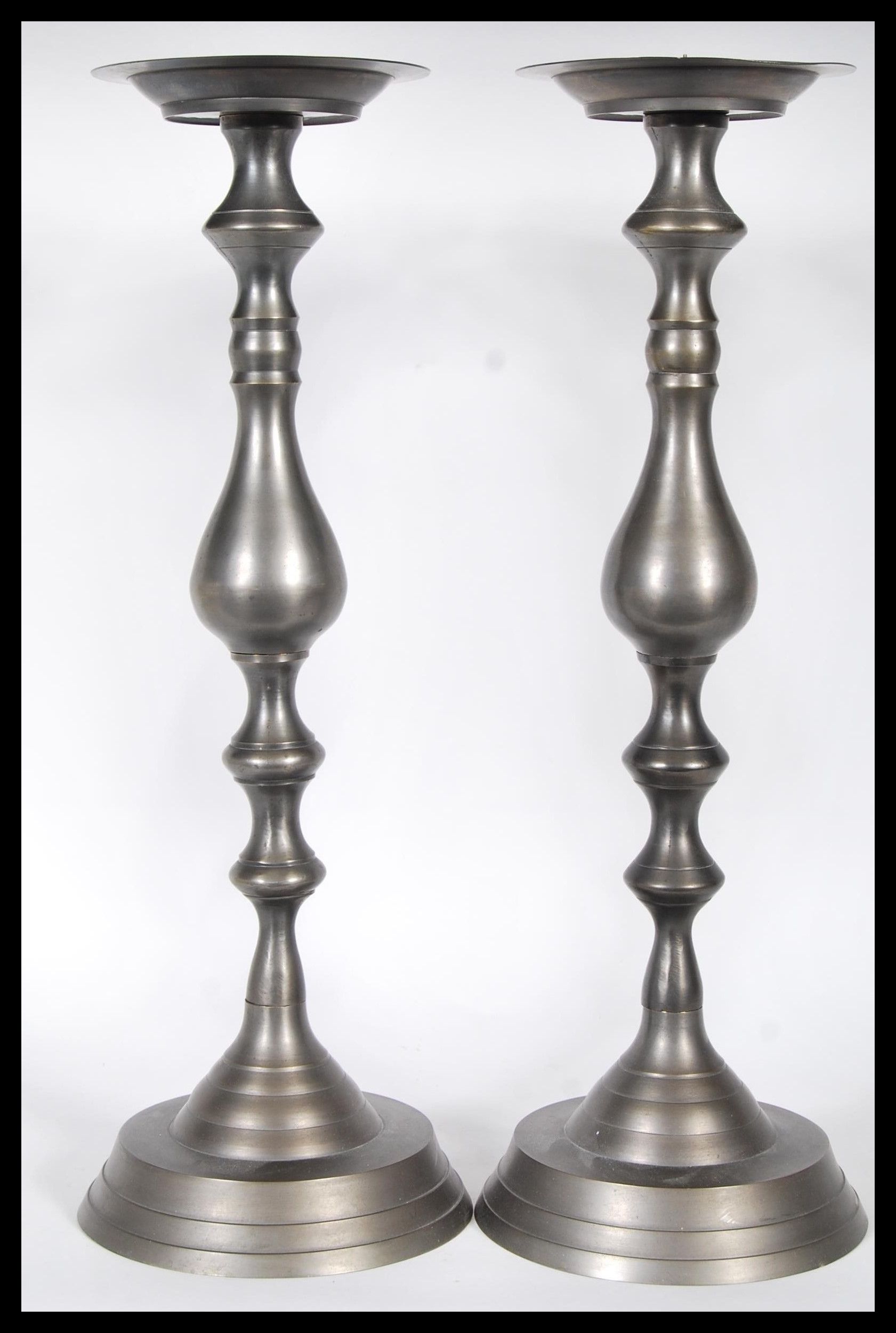A matching pair of 18th Century style pewter ecclesiastical alter table candlesticks of large