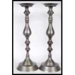 A matching pair of 18th Century style pewter ecclesiastical alter table candlesticks of large